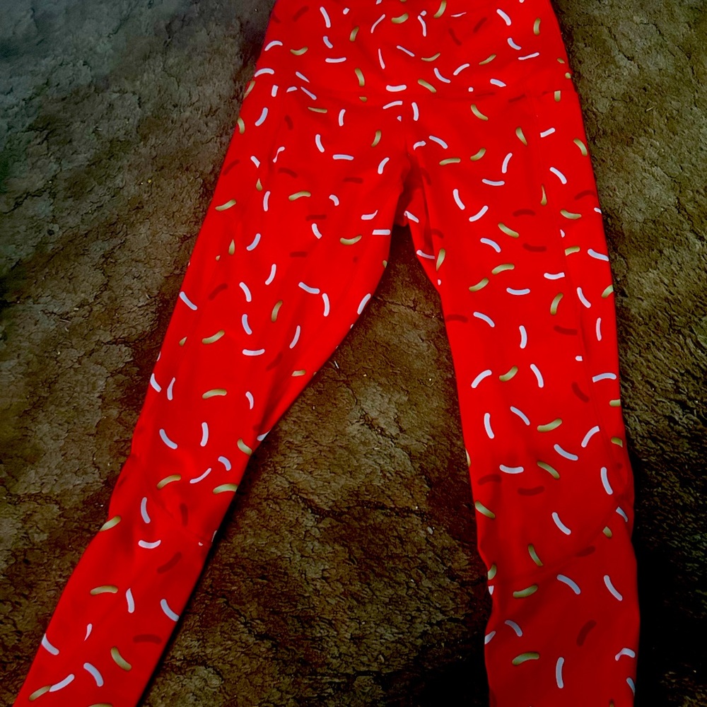 Feed me fight me red sprinkle leggings.
